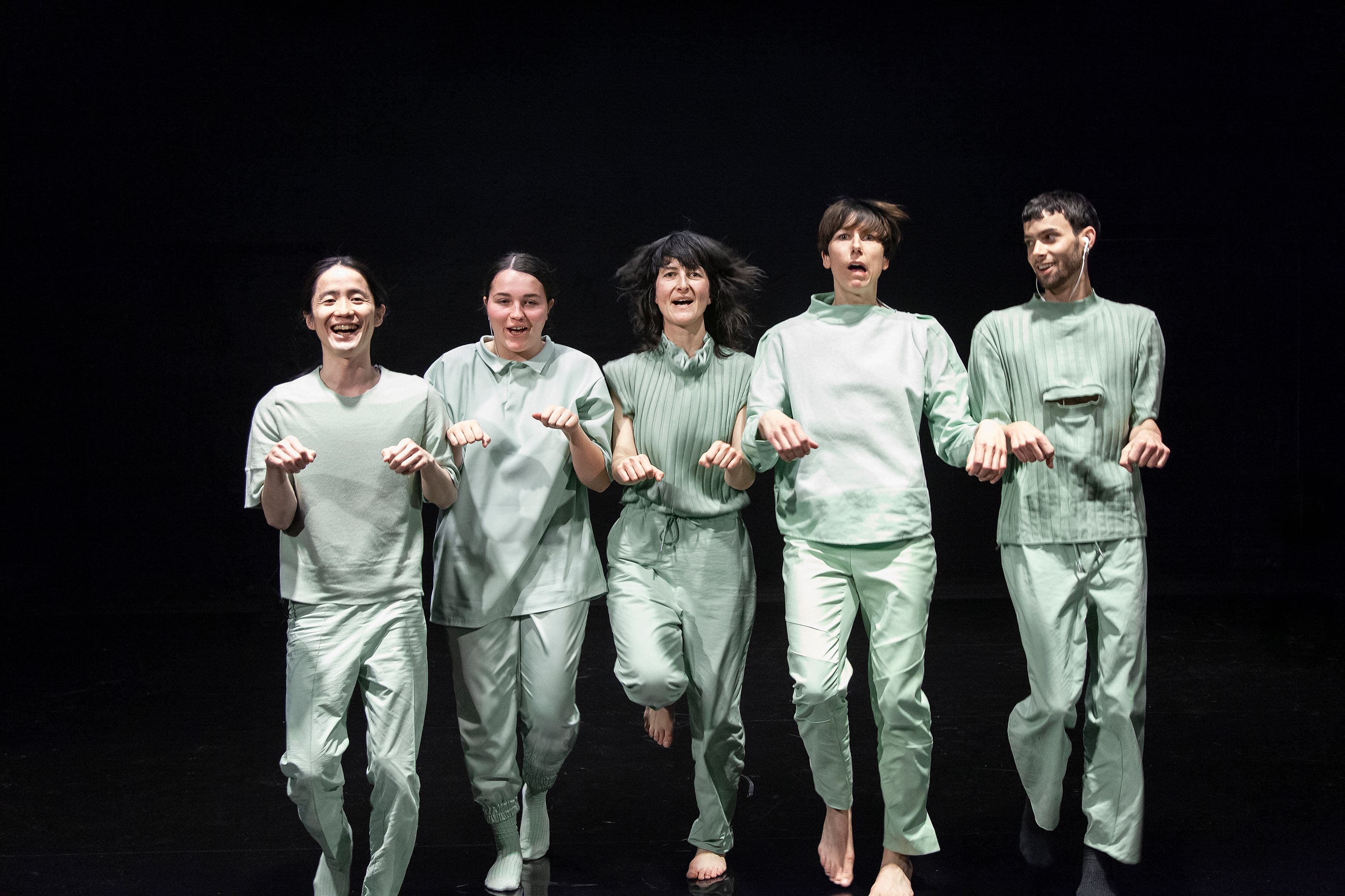 Living room with dark green three-seater sofa